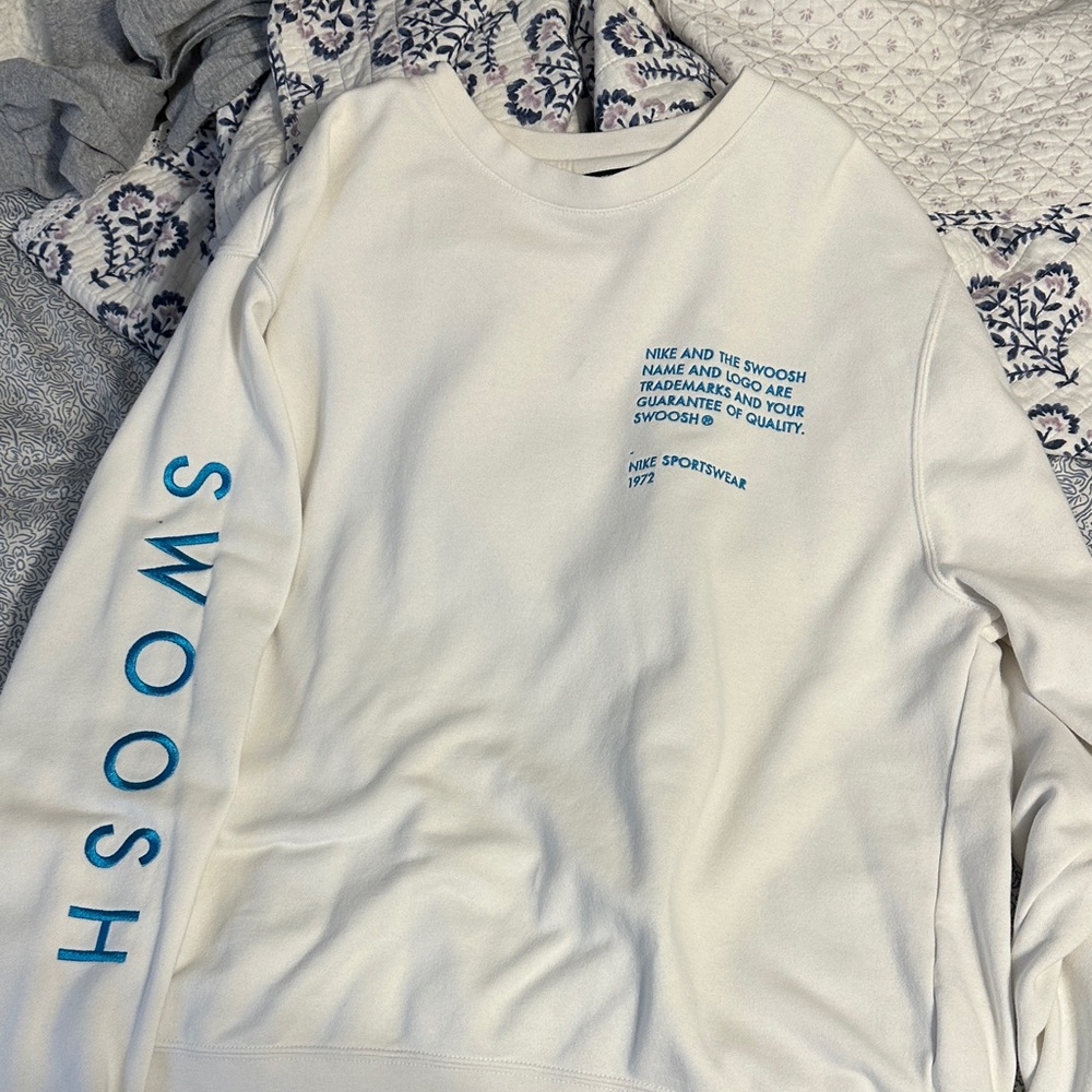 Nike Men's White Crewneck Sweater with Blue Accents